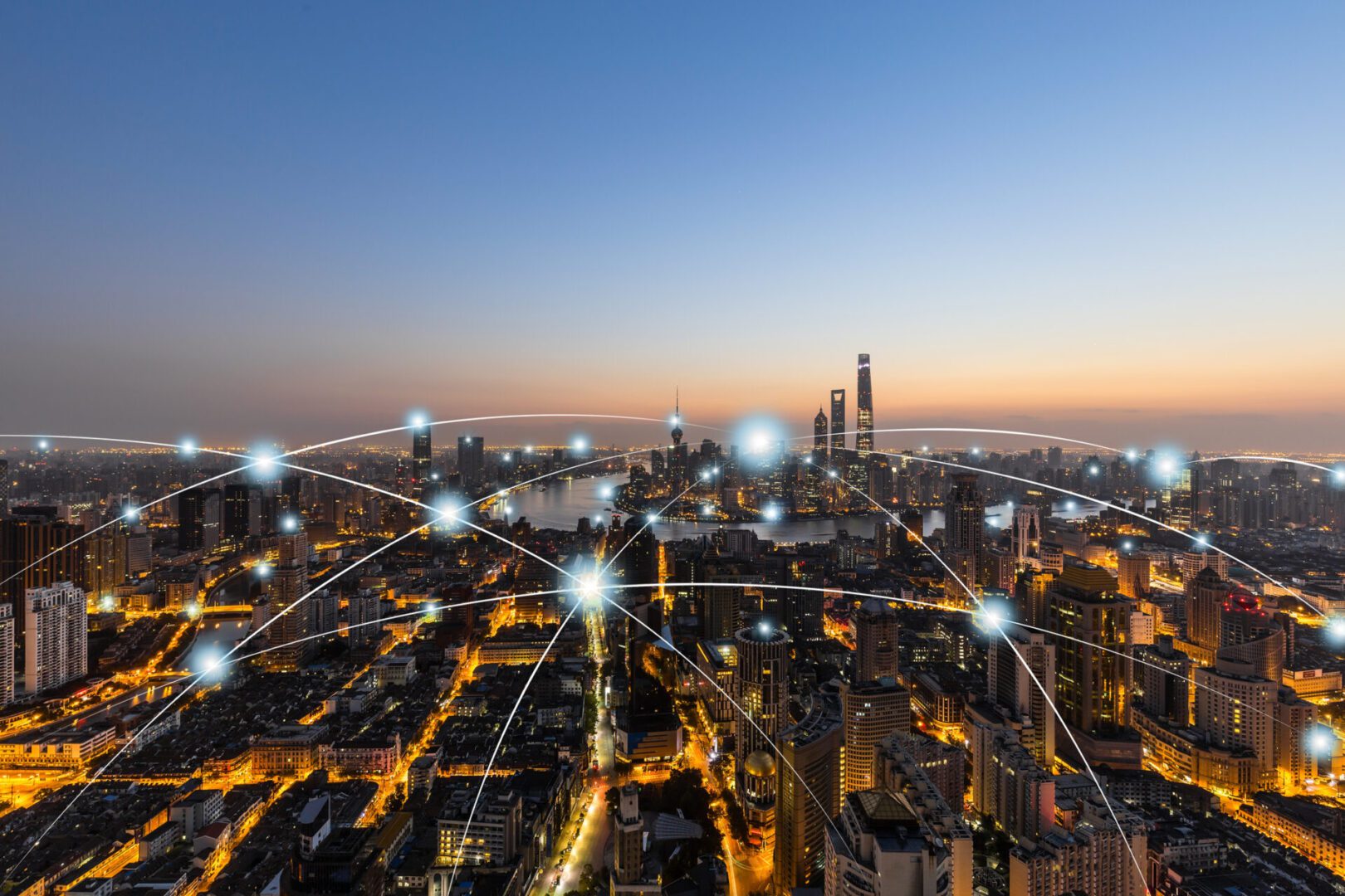 City skyline with digital network overlay